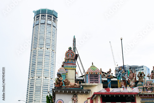 Komtar tower looming over sri mahamariamman temple in georgetown, penang, malaysia