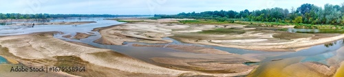 Aerial panoramic view of dried riverbed during record summer drought, historic low water level of the Vistula river in Poland.