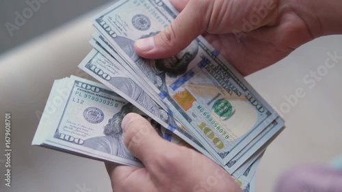 Man Counting Dollar Bills Close-Up