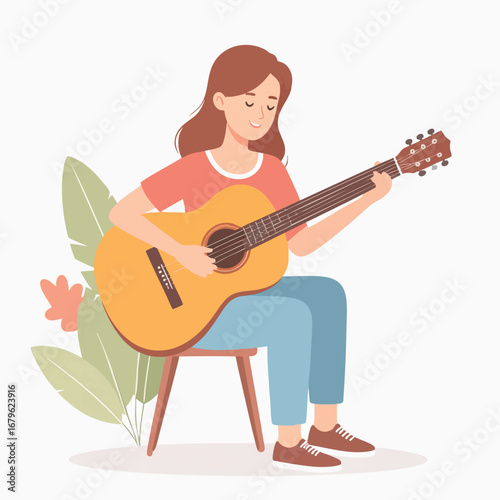 A young woman serenely plays an acoustic guitar, seated amidst foliage.