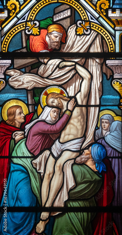 Obraz premium Stained glass (1914) of The Way of the Cross. Thirteenth station: Jesus' body is taken down from the cross.