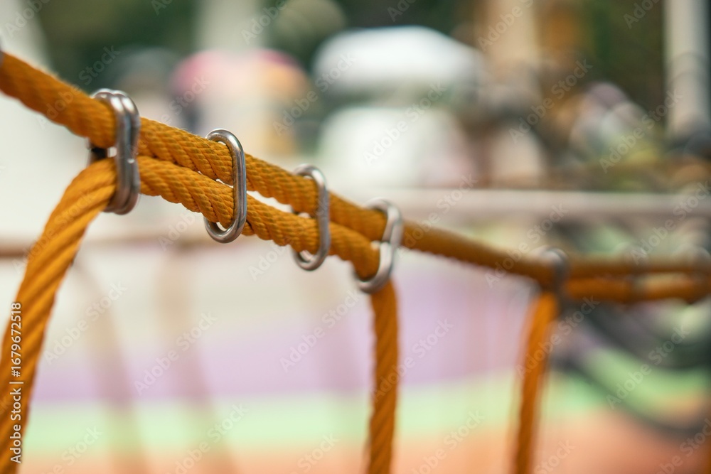 custom made wallpaper toronto digitalBright orange synthetic ropes connected with a sturdy metal shackle on a dark background