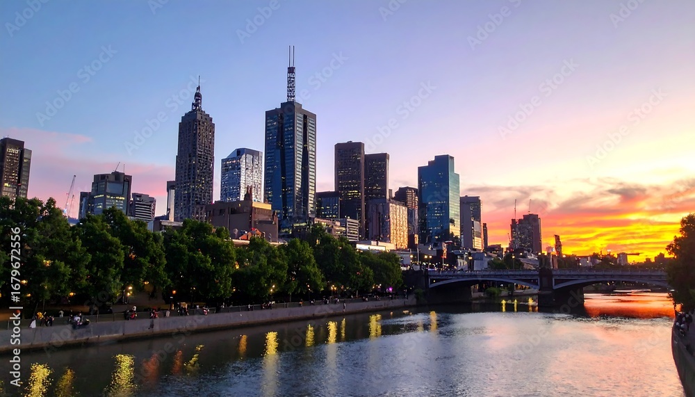 Obraz premium City skyline at sunset over a river (2)