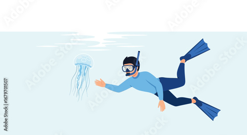 Diver Approaching a Bioluminescent Jellyfish Underwater in the Deep Blue Ocean