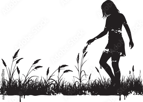 Silhouette of a graceful woman gently touching grass in monochro