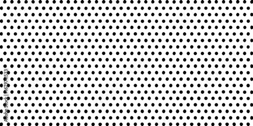 Seamless pattern of evenly spaced black dots on a white background creating a classic polka dot design