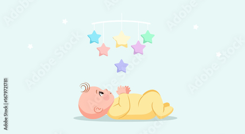 Cute baby looking up at a star mobile in soft colors and a light blue background