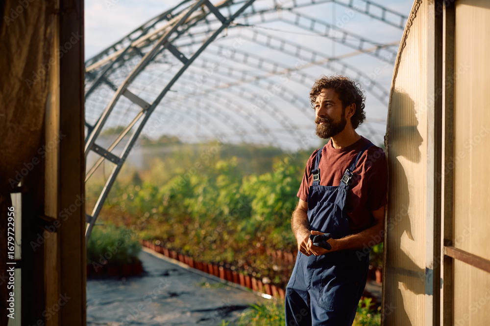 Fototapeta premium Pensive farm owner taking a break from work.