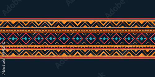 Geometric navajo tribal pattern with diamonds and zigzags in orange red and blue on dark background
