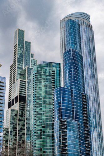 City architecture. Modern glass building. Reflective glass architecture. Architecture in business district. Building architecture. Business building. Glass building. Business city. Office center
