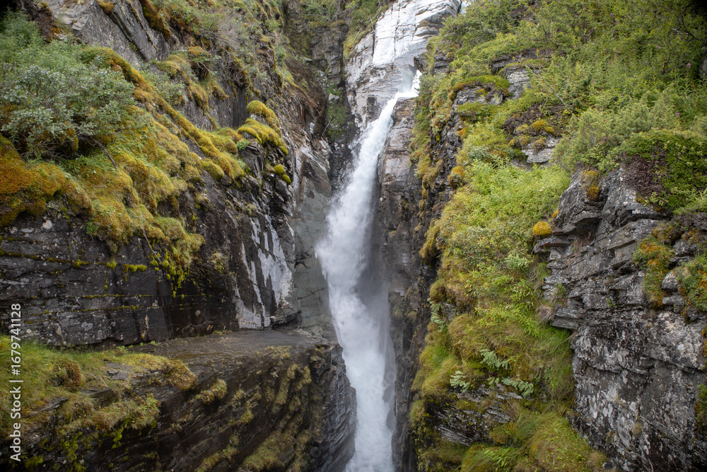 Naklejka premium Silverfallet waterfall near the mountain village of Bjorkliden in Kiruna municipality, northern Sweden.