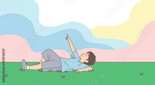 Boy Reclining On Green Grass Points To Colorful Sky Enjoying Quiet Moments Outdoors