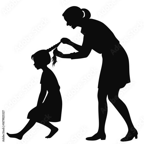 Mother braiding daughter’s hair