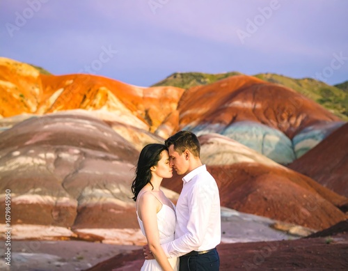 Couple embracing in colorful mountains