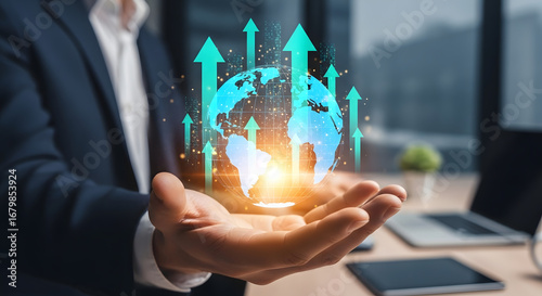 Businessman holding glowing earth with upward arrows representing growth