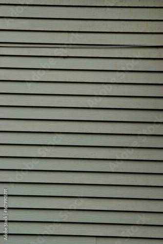 Green wooden siding