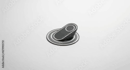 Modern Black and Silver Rotary Knob on a White Surface.