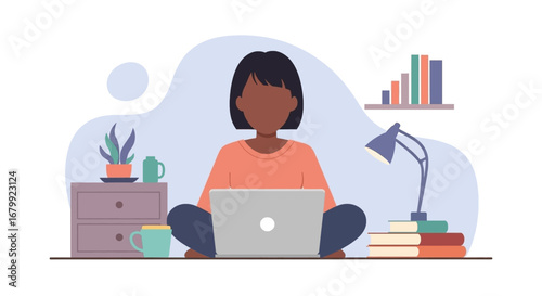 Young woman focused on remote work or online learning, using a laptop in a comfortable home office setting. Represents productivity, freelance, and study.