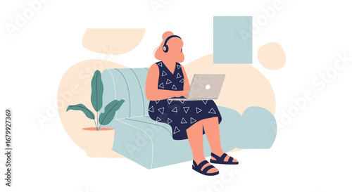 Woman in headphones uses laptop on a couch, illustrating remote work, online education, or comfortable digital leisure at home.