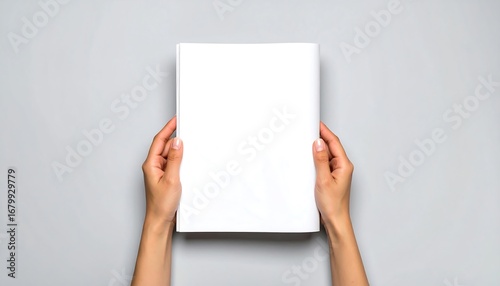 Blank magazine held by hands