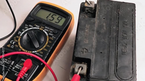 Testing Motorcycle Dead Battery Voltage with Multimeter Automotive Electrical Diagnostic Check.