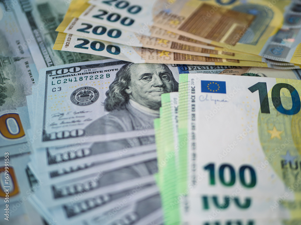 Fototapeta premium Assorted Currency Notes: 100 Euro and 200 Dollar Bills