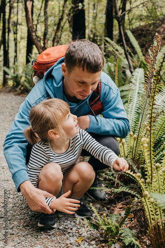 A father and daughter explore a nature trail on a forest path, adventure. Travel. New Zealand