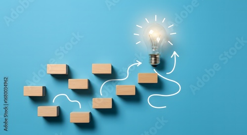 Wooden Blocks Forming a Path to a Glowing Lightbulb, Symbolizing Innovation