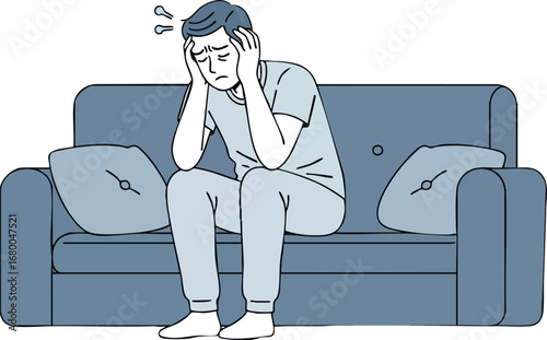 Stressed and anxious young man sitting on the sofa.