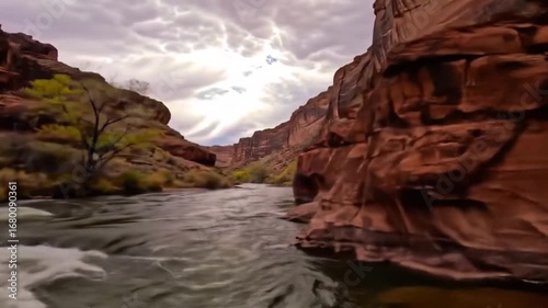 River Flowing Through A Canyon On A Cloudy Day Landscape
