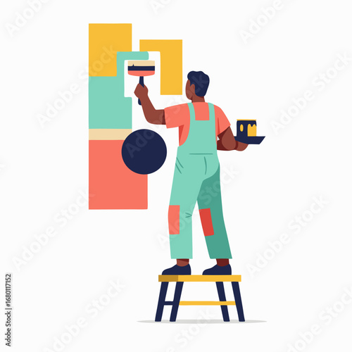 Modern painter on stool adds colorful geometric shapes to wall for home decor project