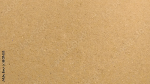 Vector cardboard realistic background. Texture of kraft paper. Brown color paper shown grain details on it's surface.
