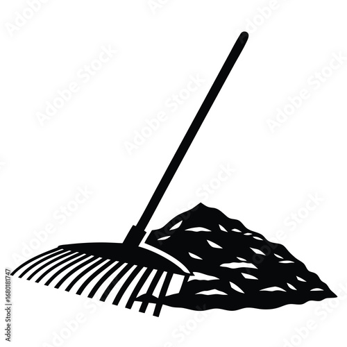 Black and white illustration of a rake collecting a pile of leaves
