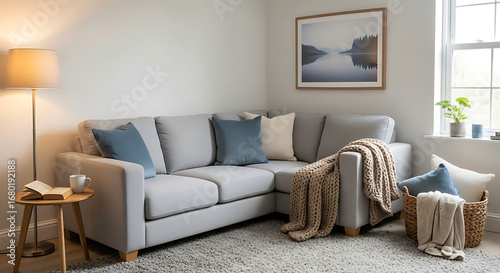 Cozy sectional sofa with throw blankets and decorative pillows in a living room setting.
