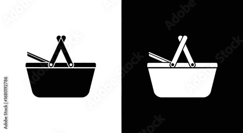 A picnic basket full of food, a black and white icon symbolizing an outdoor meal, leisure, and a summer outing.