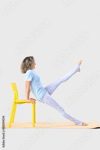 Sporty mature woman doing y...