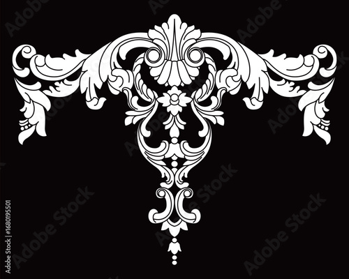 Classic ornate decorative wood carving with elegant flowing symmetrical scroll details.