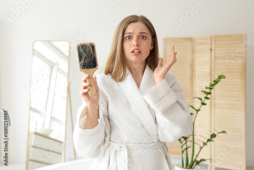 Worried young woman with ha...