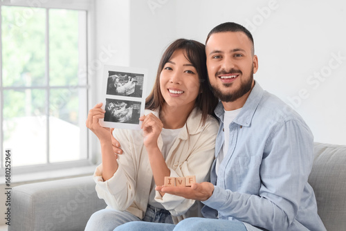 Young couple with sonogram ...