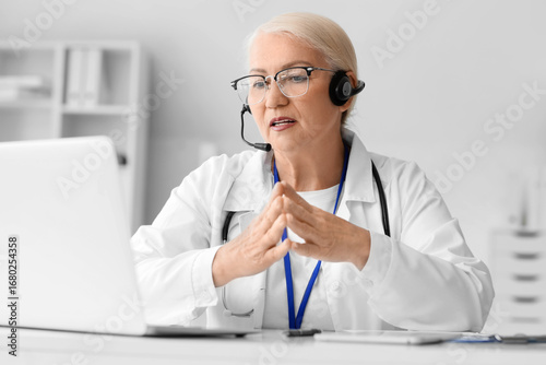 Female doctor with headset ...