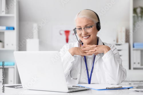 Female doctor with headset ...