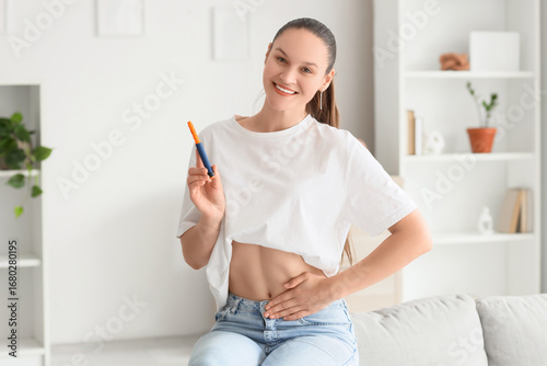 Smiling young woman with sy...