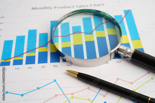 Magnifying glass on charts graphs paper. Financial development, Banking Account, Statistics, Investment Analytic research data economy.
