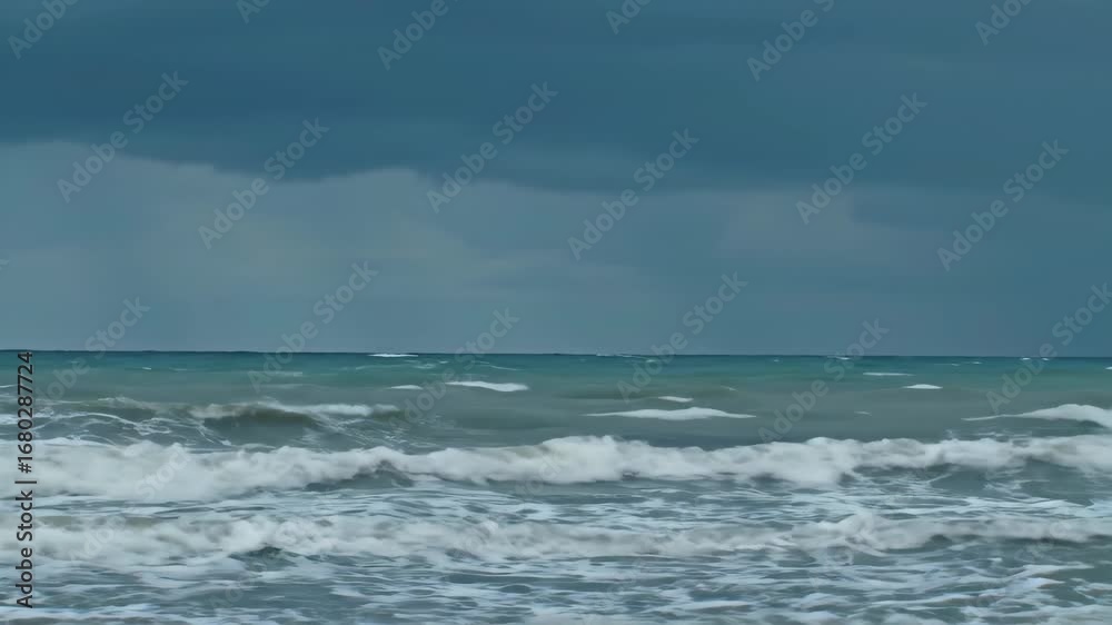 Overcast sky over the ocean with turbulent waves on a stormy day Overcast sky over the ocean with turbulent waves on a stormy day