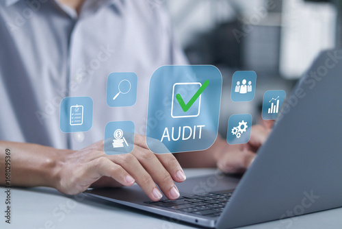 Business audit concept, data analysis, financial reporting, auditing practices and performance metrics. businessman using laptop with business audits, financial reviews and corporate assessments.