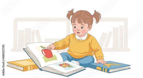 An adorable toddler pointing at an apple in a book while sitting on the floor