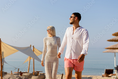 Couple enjoys a sunny beach...