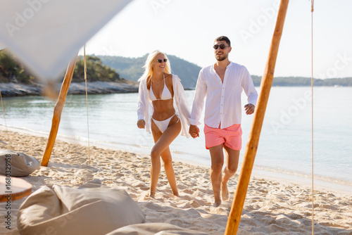 Couple enjoying a sunny bea...