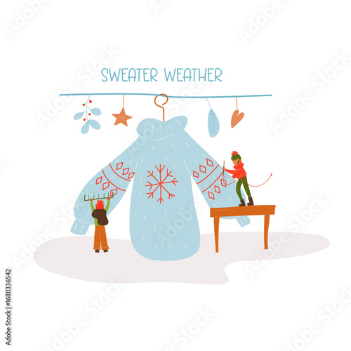 Two miniature elves take care of the sweater. They sew up a sweater. Winter. New Year. Christmas Cozy