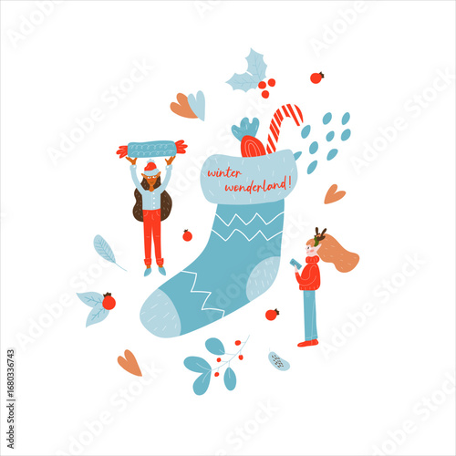 Two miniature elves put candy in a Christmas sock. Winter. New Year. Christmas. 